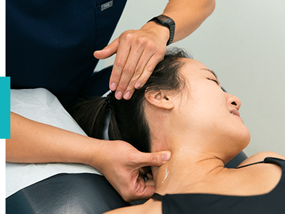 doctor treating patient with whiplash from car accident