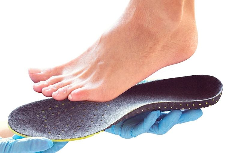 fitting orthotics on a patient